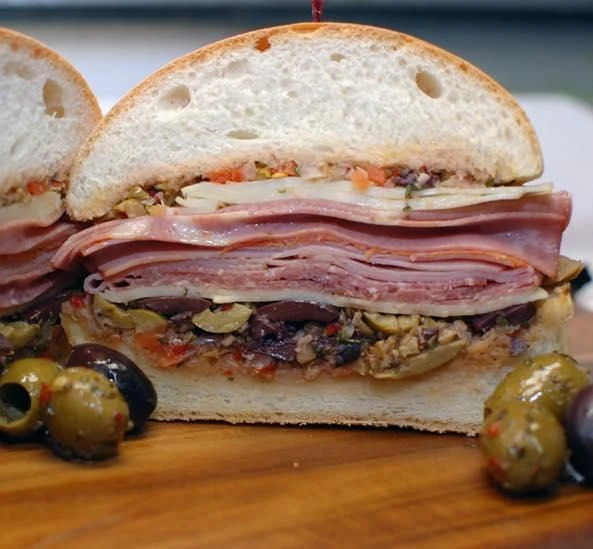 Pastore’s Muffalettini sandwich with layered deli meats and olive salad